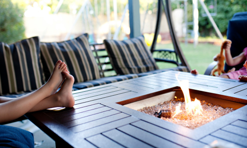 Feet on a patio fireplace